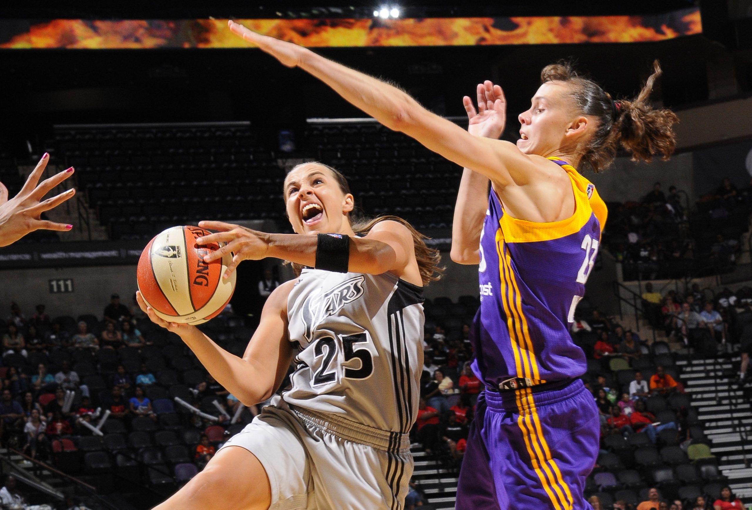 Becky Hammon (left), shown here during her WNBA playing days with the San Antonio Stars, became first woman to serve as a head coach in NBA history. (Courtesy photo/Getty Images)